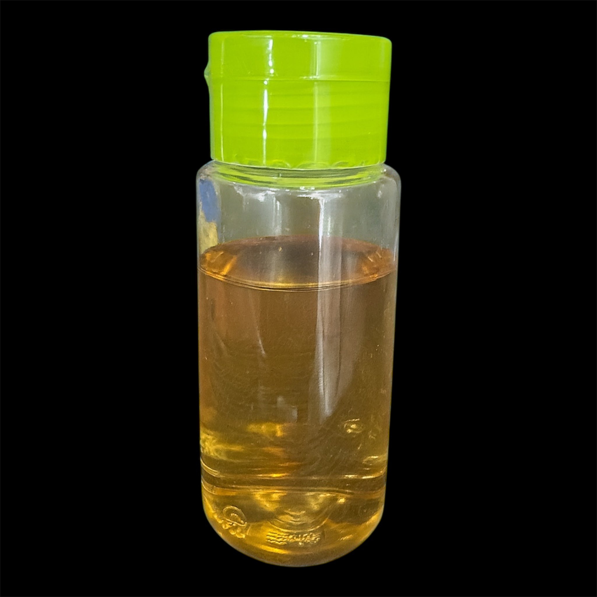 3oz vinegar eel starter culture in a clear plastic bottle with green cap, filled with golden liquid, used as live food for feeding small aquarium fish and fry.